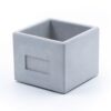 A grey Cube made of Concrete, handmade in Germany.