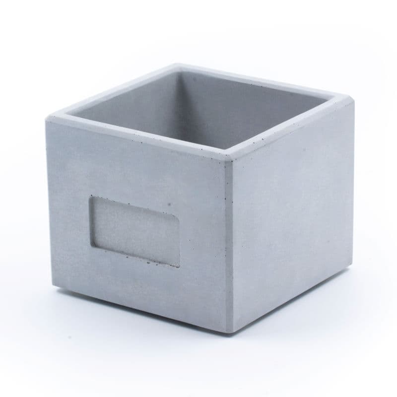 A grey Cube made of Concrete, handmade in Germany.