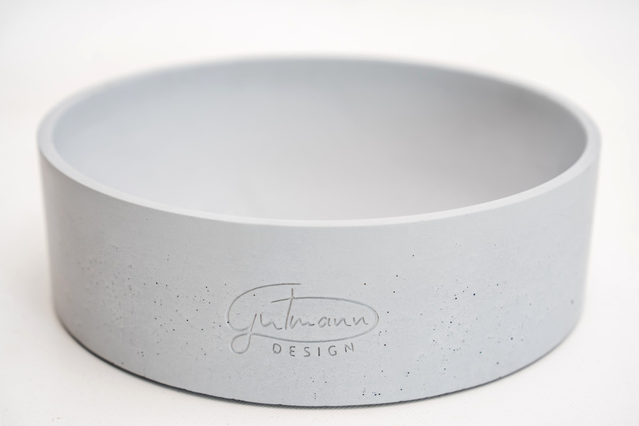 Eine Designer Obstschale aus grauem Stein Beton.